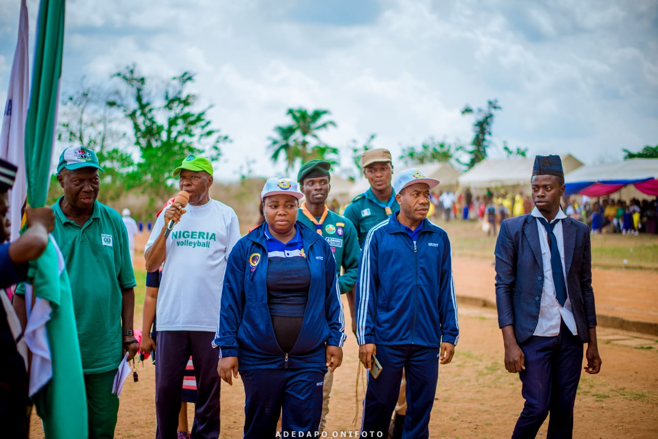 School officials and guests at sports field