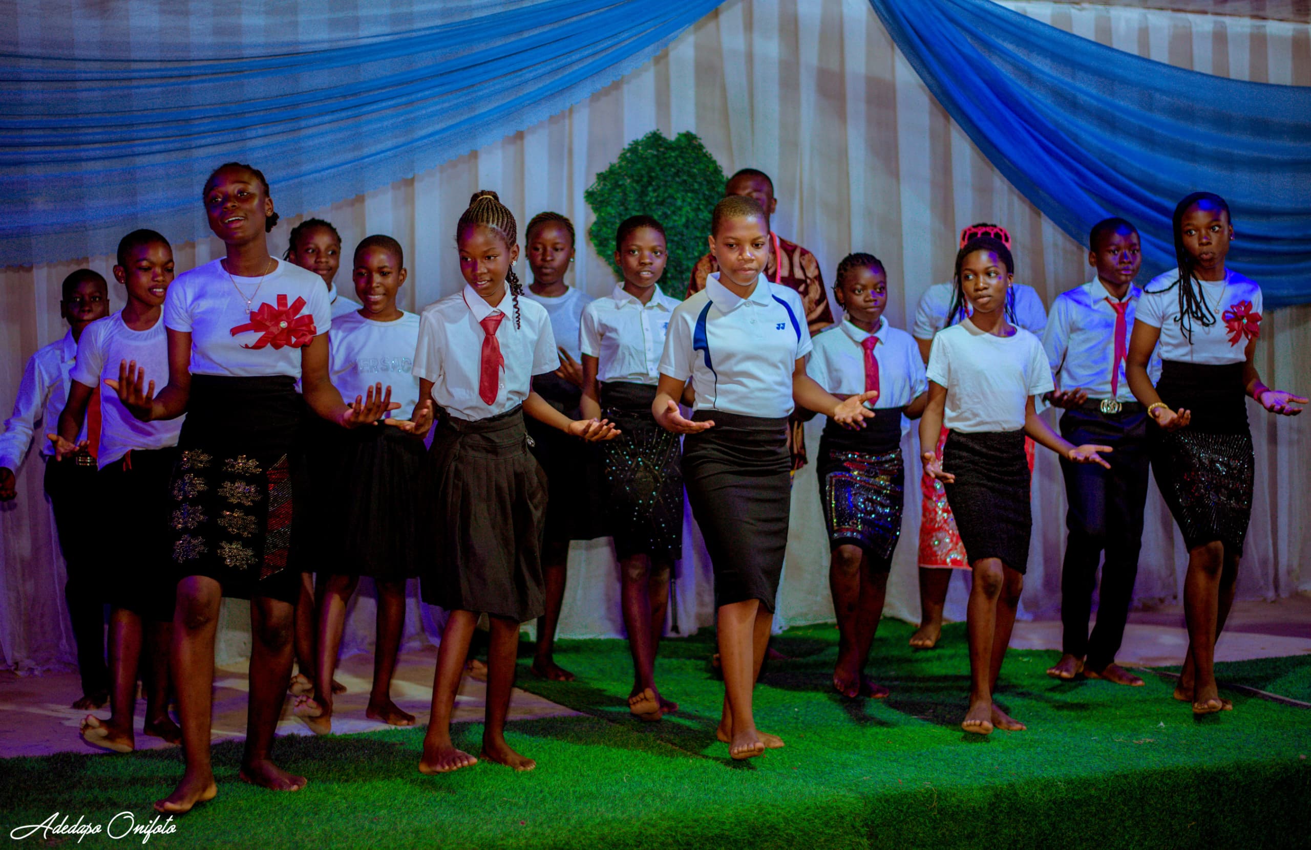 Students performing dance at school ceremony