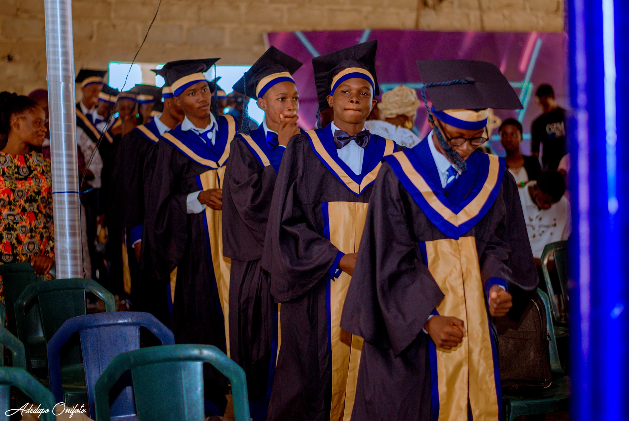 Graduates procession entering ceremony hall