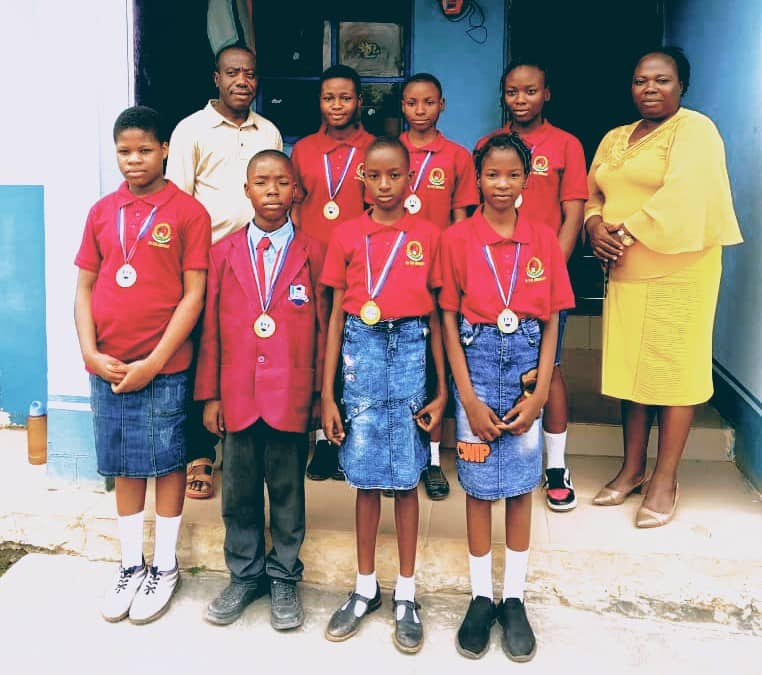 Medal-winning pupils with teachers group photo