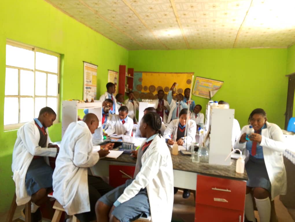 Students performing practicals in science lab