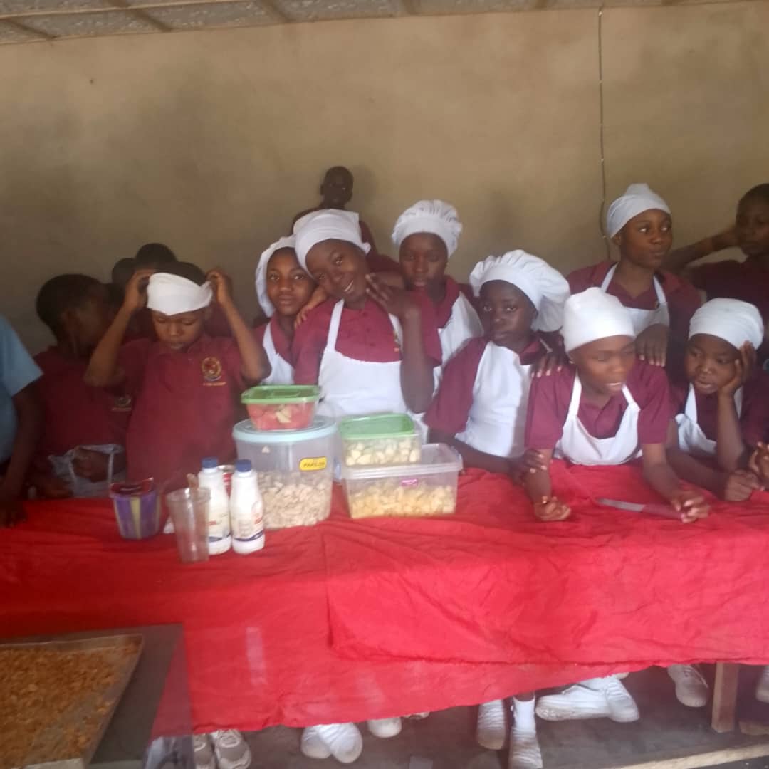Home economics class presenting prepared dishes