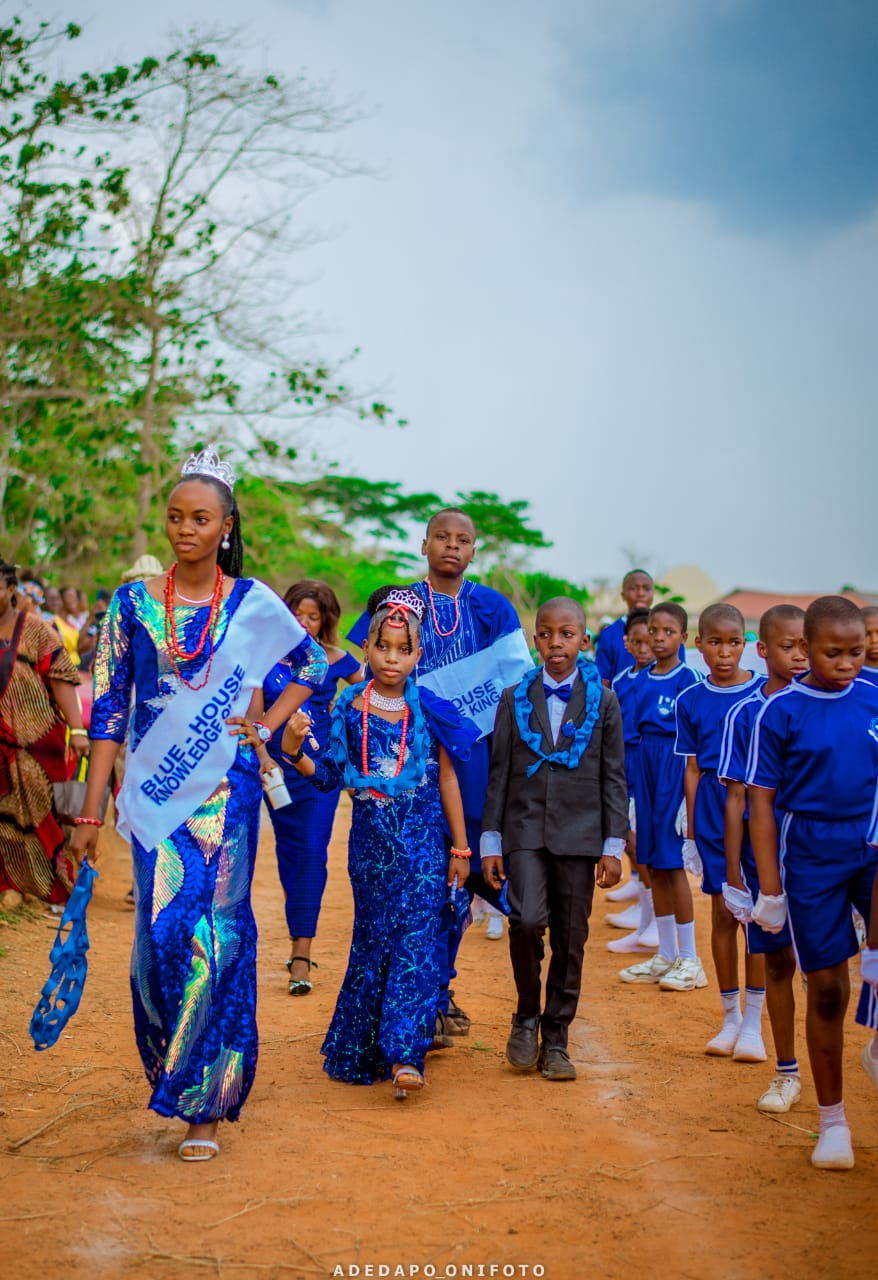 Blue house students leading parade line